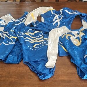 Blue and White Dance Costumes with Dynamic Swirl Patterns